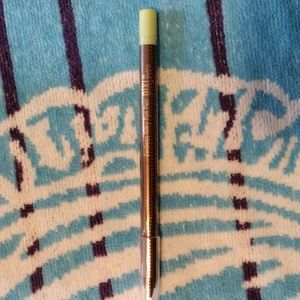 Pixi Eye Pen in a golden bronze color.